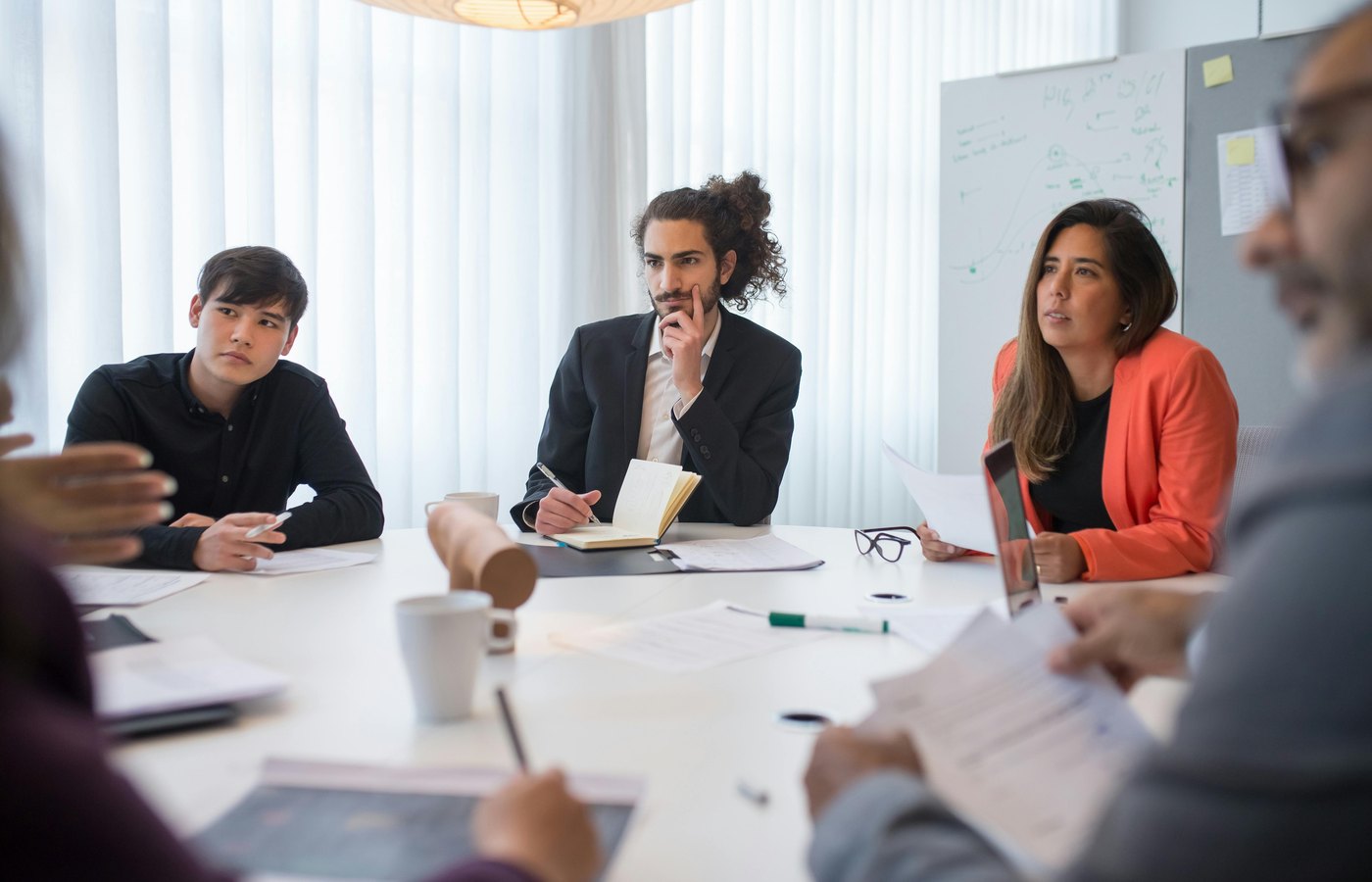 Business group reviewing documents